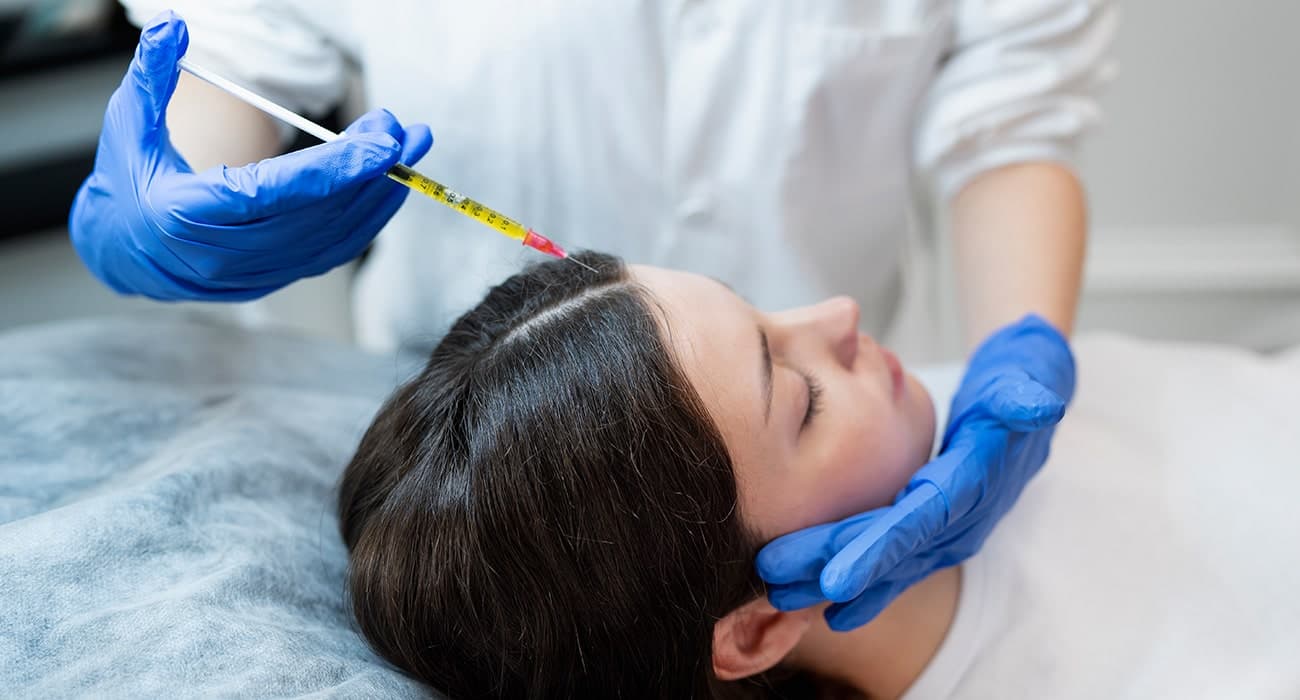 PRP being injected into a patient's scalp